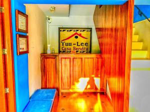 a living room with a blue couch in a room at Yuu-Lee Casa Bendita Huatulco in Santa Cruz Huatulco