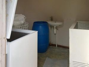 a bathroom with a sink and a blue barrel at 6 person holiday home in ENGAVÅGEN-By Traum in Åmnes +16 photos