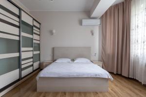 Ένα ή περισσότερα κρεβάτια σε δωμάτιο στο Oloy Apartment