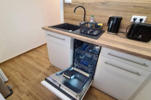 Kuchyň nebo kuchyňský kout v ubytování Kadarka apartman - Szekszárd