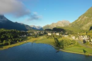 an aerial view of a village in the mountains at Maloja Palace Suites CO2-Neutral in Maloja
