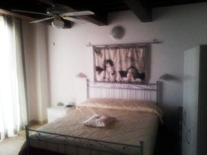 Postel nebo postele na pokoji v ubytování Agriturismo La Nocciolina