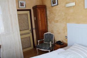 Postel nebo postele na pokoji v ubytování Hotel du Gambrinus