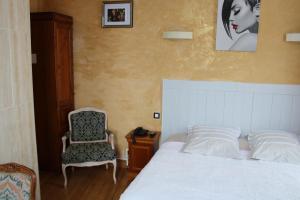 Postel nebo postele na pokoji v ubytování Hotel du Gambrinus