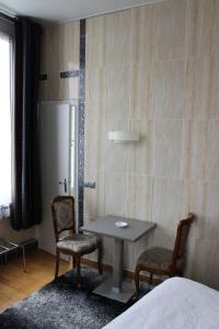 Postel nebo postele na pokoji v ubytování Hotel du Gambrinus