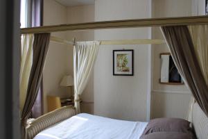 Postel nebo postele na pokoji v ubytování Hotel du Gambrinus