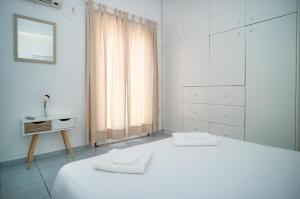 Postel nebo postele na pokoji v ubytování Villa Georgia