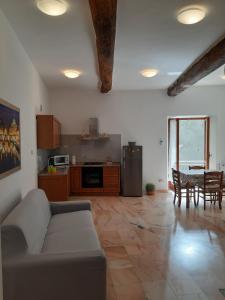 a living room with a couch and a table at Da Rocky in Riomaggiore +13 photos
