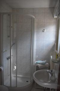 a bathroom with a shower and a sink at Hiša ob jezeru - House by the Lake in Kranjska Gora +74 photos