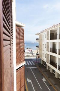 a view from the balcony of a building at Apartamento con piscina de temporada a 50m del mar in Port de la Selva