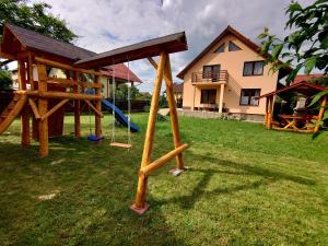 a playground in the yard of a house at Casa Lalelelor in Râşnov
