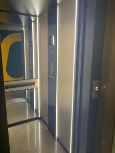 an empty elevator in a building with a door at MAR60 Apartments in Caorle