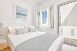 Postel nebo postele na pokoji v ubytování Pelican Paros