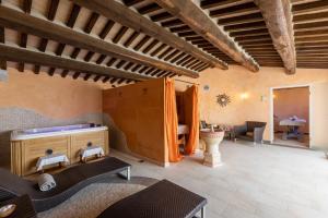 a living room with a table and a couch at La Melosa Resort & Spa in Roccastrada