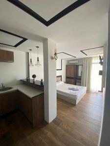 Uma cama ou camas num quarto em Apartments Stanaj