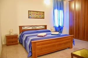Tempat tidur dalam kamar di Fra il Verde e l'Azzurro