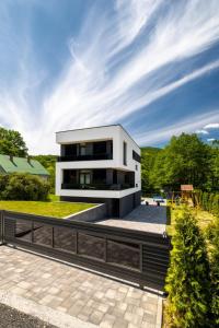 a large white house with a roof at Luxury Villa Rebecca in Brestovac