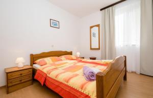 Postel nebo postele na pokoji v ubytování Apartments Halovic