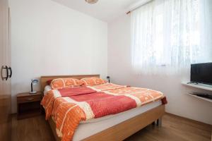 Postel nebo postele na pokoji v ubytování Apartments Dara