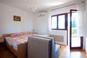 Postel nebo postele na pokoji v ubytování Apartments Dara