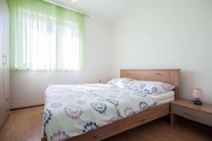 Postel nebo postele na pokoji v ubytování Apartments Dara