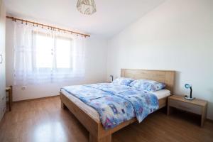 Postel nebo postele na pokoji v ubytování Apartments Dara