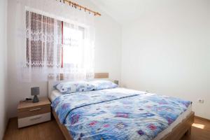 Postel nebo postele na pokoji v ubytování Apartments Dara