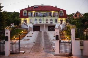 a house with a gate in front of it at Rya Residence Oradea in Oradea