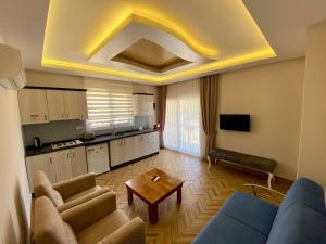 A television and/or entertainment centre at Yalcin Hotel & Villas