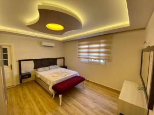 A bed or beds in a room at Yalcin Hotel & Villas