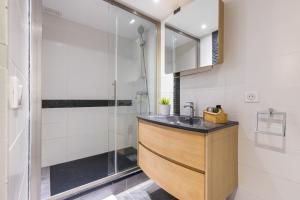 a bathroom with a sink and a shower at Duplex in Rue de la Préfecture Old Town 2 Bdrs in Nice