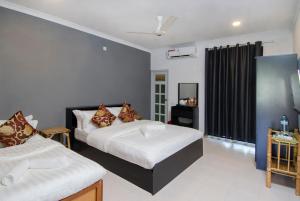 Ein Bett oder Betten in einem Zimmer der Unterkunft Paradise Retreat, Maafushi