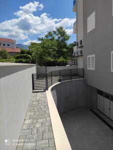 a walkway on the side of a building at Apartments Villa Hadria in Makarska