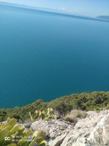 a view of the water from the top of a cliff at Apartments Villa Hadria in Makarska