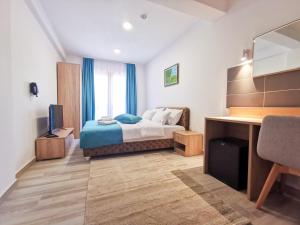 Un pat sau paturi într-o cameră la Hotel Agape