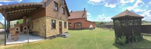 a model of a house with a playground in a yard at Гостинний дім in Szack