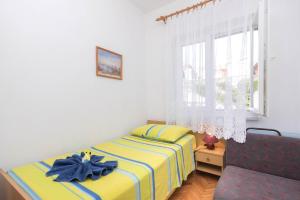 Ein Bett oder Betten in einem Zimmer der Unterkunft Apartments Salis