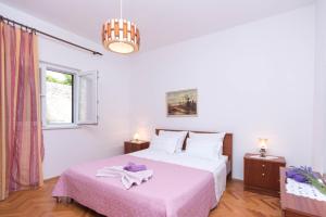 Ein Bett oder Betten in einem Zimmer der Unterkunft Apartments Salis