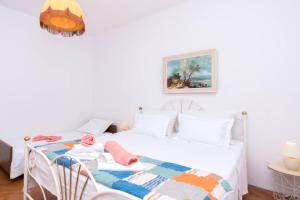 Ein Bett oder Betten in einem Zimmer der Unterkunft Apartments Salis