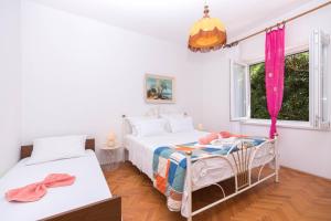 Ein Bett oder Betten in einem Zimmer der Unterkunft Apartments Salis