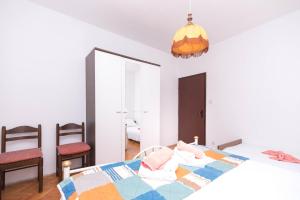 Ein Bett oder Betten in einem Zimmer der Unterkunft Apartments Salis