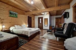 Postel nebo postele na pokoji v ubytování Magnat Inn Sauna & Relax