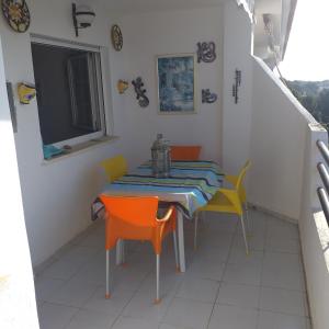 a small dining room with a table and chairs at A 300 mètre de la plage plein centre alcossebre in Alcossebre