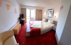 Ένα ή περισσότερα κρεβάτια σε δωμάτιο στο Family Hotel Desirée