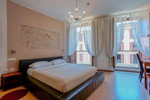 Postel nebo postele na pokoji v ubytování Le Suite Sul Corso