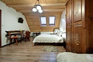Postel nebo postele na pokoji v ubytování Magnat Inn Sauna & Relax