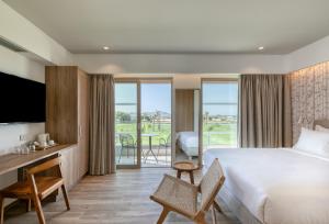 Postel nebo postele na pokoji v ubytování Utopia Blu Hotel + 37 fotografií