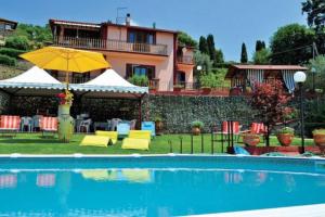 a house with a swimming pool in front of a house at La Cupoletta -Holiday House - GILDA in Trevignano Romano