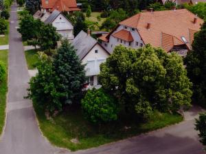 an aerial view of a residential neighborhood with houses and trees at Nyírfa Apartman in Vonyarcvashegy