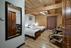Postel nebo postele na pokoji v ubytování Magnat Inn Sauna & Relax